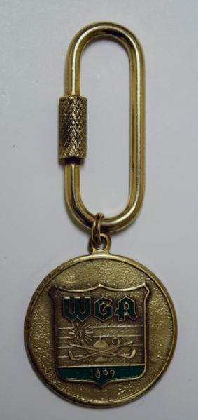 Golf Medal WGA 1899  has oval clip to hang it on something.