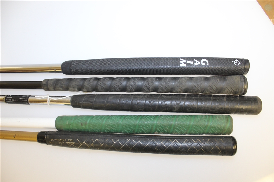 Group of Four Various Eccentric Golf Putters with Picker