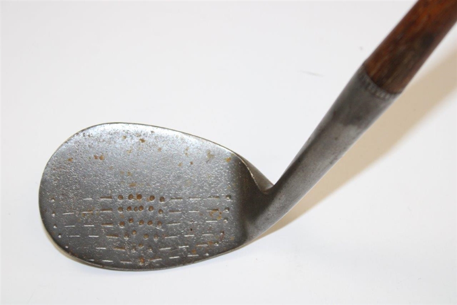 A. Mercer Tomahawk Accurate Niblick Hand Punched Golf Club