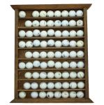 Wood Golf Display with Miscellaneaous Logo Golf Balls