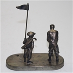 Golfer Setting Up for Putt To Hole with Caddy & Flag Stick