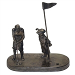 Golfer Setting Up for Putt To Hole with Caddy & Flag Stick