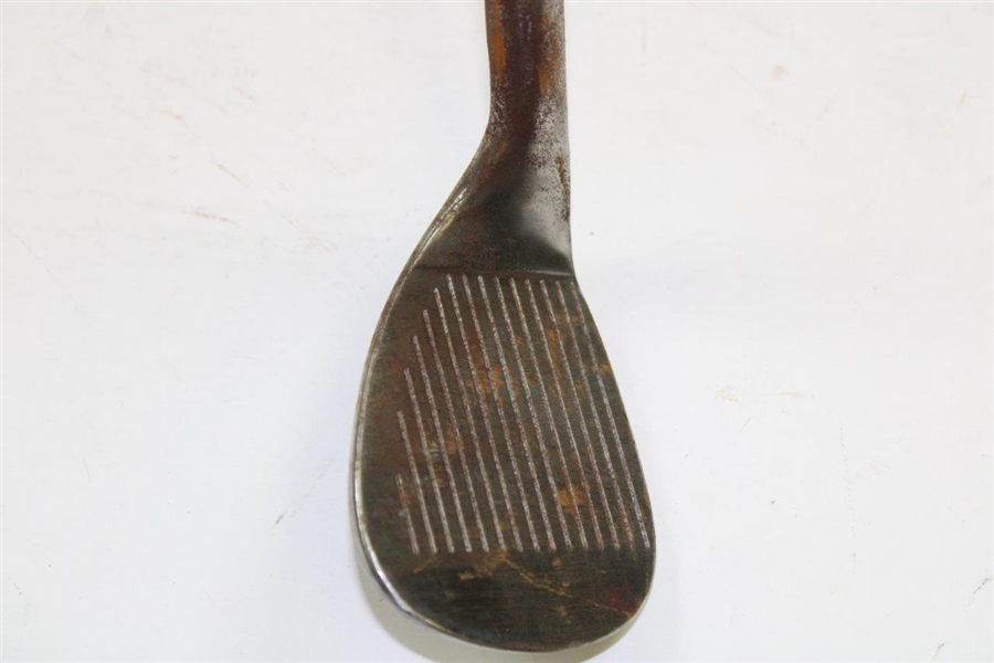 Greg Norman's Personal Used Unmarked Pitching Wedge with Lead Tape