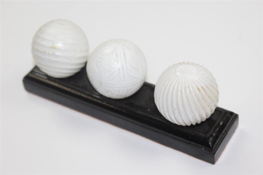 Facsimile Golf Balls On Wooden Stand