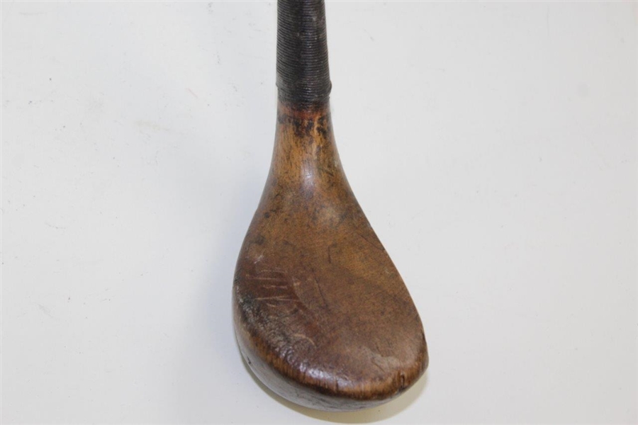 Vintage Scared Head Bulger Mashie with Brass Sole Plate