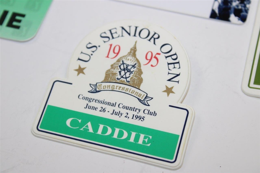 Four (4) Ralph Hackett Signed Senior Tour Caddie Badges 