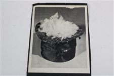 Photo With Tool For Making Golf Balls And A Top Hat With Feathers Inside