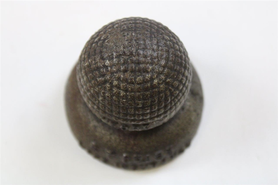 Vintage Cast Iron Advertising Paperweight Of A Gutty Ball On A Sand Tee The Ball Has Fore On One Side And Below 