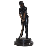 Statue Of Female Golfer Lining Up An Iron Shot 