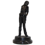 Statue Of Female Golfer Lining Up An Iron Shot 
