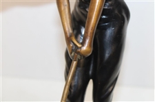 Statue Of Female Golfer Lining Up An Iron Shot 