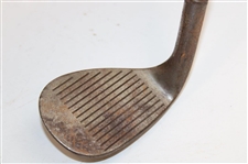 Greg Norman's Personal Unmarked Lead Tape Wedge