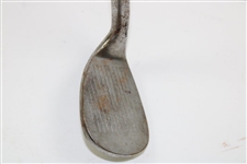 Greg Norman's Personal Used Unmarked Pitching Wedge with Lead Tape