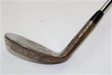 Greg Norman's Personal Used Unmarked Pitching Wedge with Lead Tape
