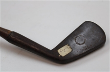 A Johnson & Company Guaranteed Hand Forged Long Iron