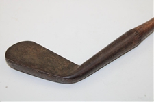 A Johnson & Company Guaranteed Hand Forged Long Iron