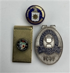 A Collection of Commemorative Golf Tournament Money Clips and a Central Intelligence Agency Lapel Pin