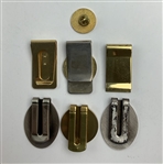 A Collection of Commemorative Golf Tournament Money Clips and a Central Intelligence Agency Lapel Pin