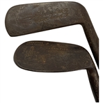 Two Vintage Hickory-Shafted Golf Clubs Including a Spalding Mid-Iron and a George Nicoll Zenith Niblick