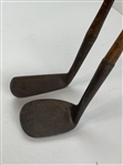 Two Vintage Hickory-Shafted Golf Clubs Including a Spalding Mid-Iron and a George Nicoll Zenith Niblick