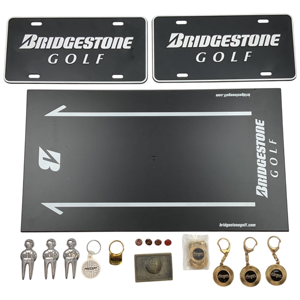 An Assortment of Golf Accessories and Memorabilia Featuring Bridgestone, Wilson, Hogan, and BagBoy