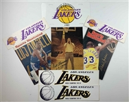 A Collection of Los Angeles Lakers Memorabilia Including Signed Sports Illustrated Magazines and Promotional Items
