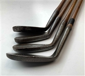A Set of Four Antique Hickory Shaft Golf Clubs Including Tom Stewart St. Andrews Irons