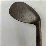 A Set of Four Antique Hickory Shaft Golf Clubs Including Tom Stewart St. Andrews Irons