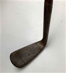 A Set of Four Antique Hickory Shaft Golf Clubs Including Tom Stewart St. Andrews Irons