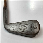 A Set of Four Antique Hickory Shaft Golf Clubs Including Tom Stewart St. Andrews Irons